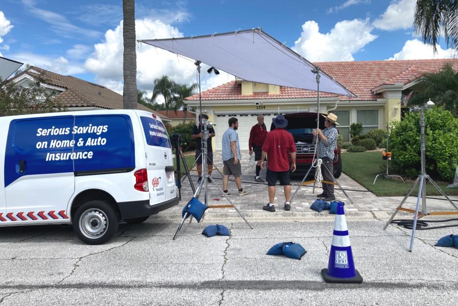 People working on the set of AAA commercial